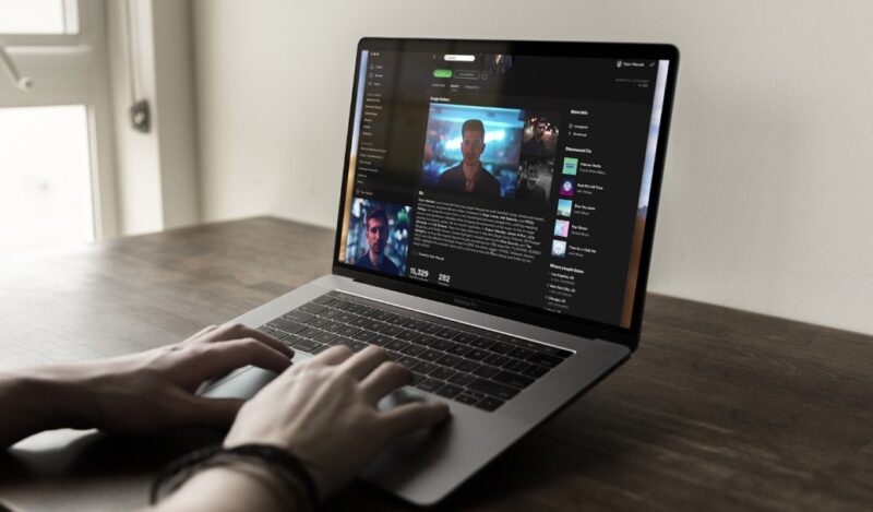 Man using Spotify website on his laptop