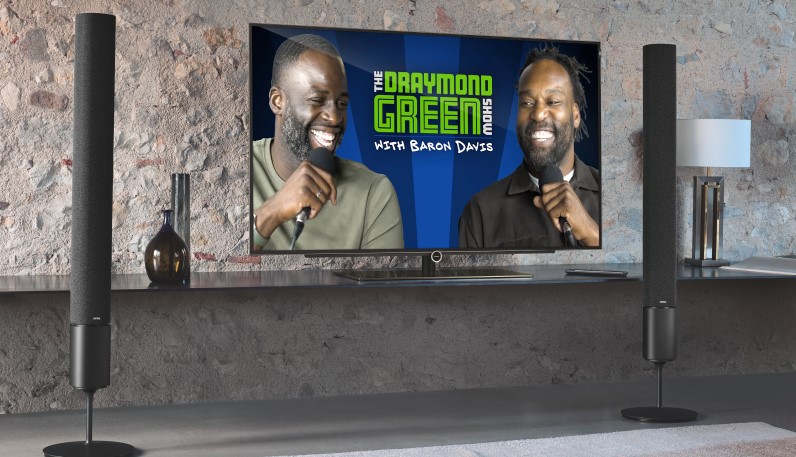 The Draymond Green Show with Baron Davis podcast is being watched on a flat-screen TV