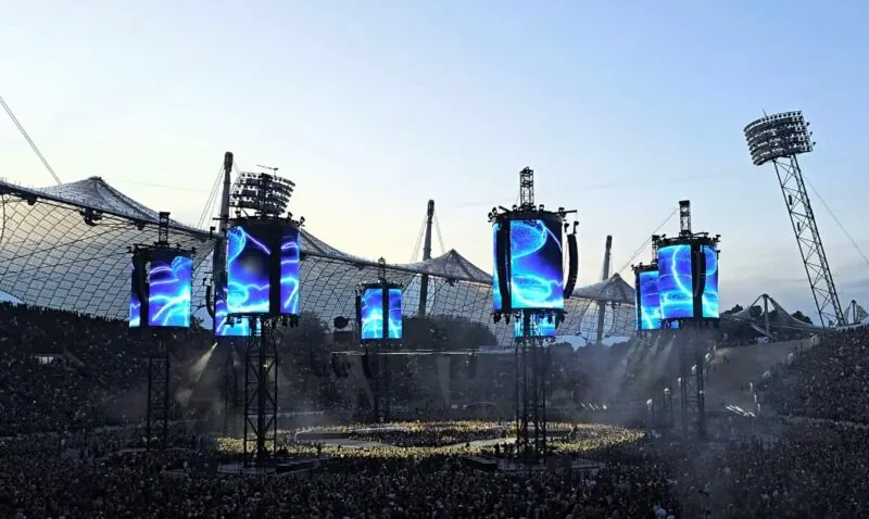 Massive LED screens illuminate the stadium during Metallica concert