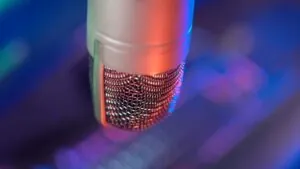 Microphone with colorful lighting and 'Podcasts That Changed Public Opinion on Key Issues'