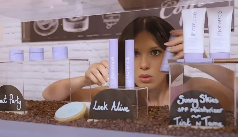 Millie Bobby Brown displays a selection of lavender-toned skincare
