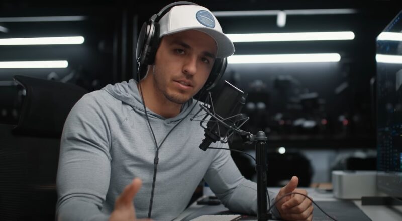 Focused and engaged, a content creator in a professional studio setting, ready to share insights