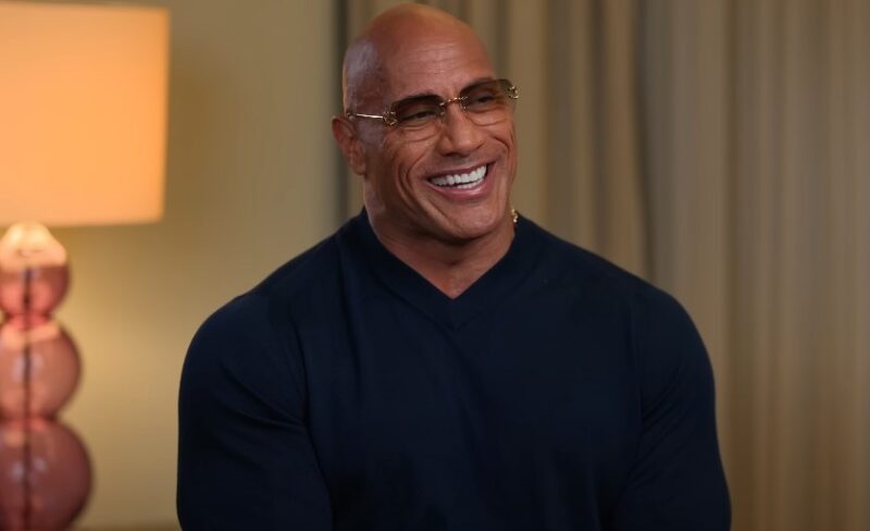Dwayne Johnson smiling during TV interview