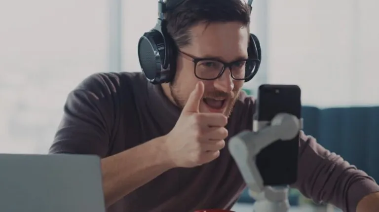 Enthusiastic creator giving a thumbs-up during a livestream