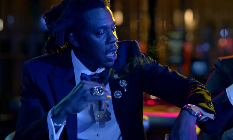 Jay Z smoking a cigar in a music video
