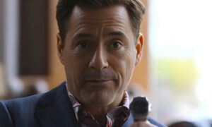 Robert Downey Jr holding a luxury watch