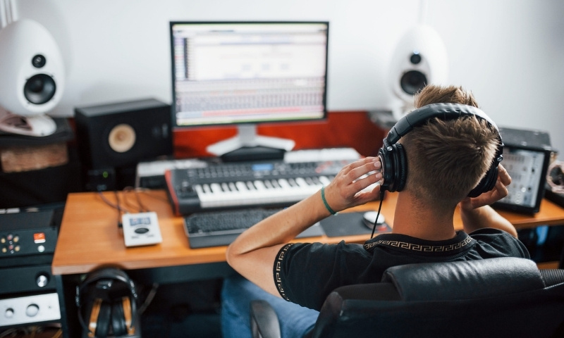 A man sitting in the recording studio